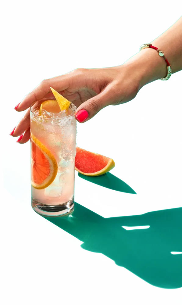 Hand holding a tequila cocktail