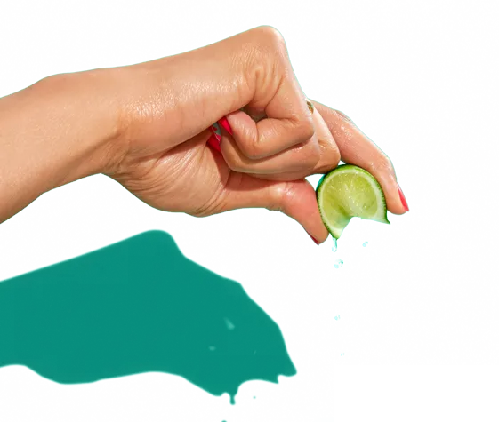 Hand squeezing a lime